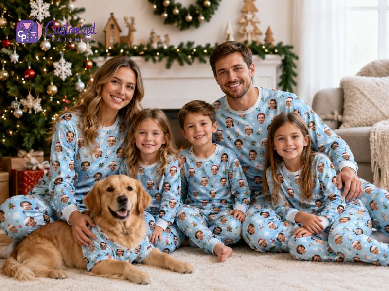 Family and golden retriever wearing matching personalized Christmas pajamas with custom face print in a festive living room.